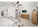 Bedroom with a large window and a chest of drawers, offering a cozy and inviting atmosphere at 3121 N Loma Vista Dr, Mesa, AZ 85213