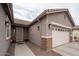 Single-Gathering home featuring desert landscaping and a two-car garage with brick trim at 3121 N Loma Vista Dr, Mesa, AZ 85213