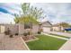 Single-Gathering home with artificial turf, desert landscaping, and a two-car garage at 3121 N Loma Vista Dr, Mesa, AZ 85213