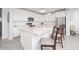 Kitchen island with granite countertops, stainless steel appliances, and subway tile backsplash at 3121 N Loma Vista Dr, Mesa, AZ 85213