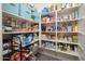 Organized walk-in pantry with ample shelving for food and storage containers at 3121 N Loma Vista Dr, Mesa, AZ 85213