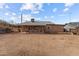 Spacious backyard with a covered patio area, ready for your landscaping ideas at 345 N Madison St, Wickenburg, AZ 85390