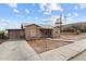 Charming single-story home with a neutral exterior and well-maintained front yard at 345 N Madison St, Wickenburg, AZ 85390