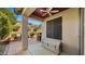 An inviting covered patio shows an outdoor dining area, a grill, and views of the landscaped yard at 3708 W Rushmore Dr, Anthem, AZ 85086