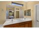 Bright bathroom with double sink vanity, large mirror, and contemporary finishes offers style and convenience at 3708 W Rushmore Dr, Anthem, AZ 85086