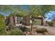 Charming single-Gathering home with a desert landscape and mature trees in the front yard at 3708 W Rushmore Dr, Anthem, AZ 85086