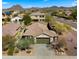 Aerial view of a single Gathering house with a well manicured front yard and desert landscaping at 3708 W Rushmore Dr, Anthem, AZ 85086