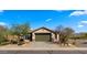 Beautiful single-Gathering home with desert landscaping, a two car garage and green garage door at 3708 W Rushmore Dr, Anthem, AZ 85086