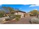 A charming desert-landscaped front yard in front of a single-story home at 3708 W Rushmore Dr, Anthem, AZ 85086