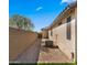 Low maintenance side yard featuring gravel, a privacy wall, and a walkway to the backyard gate at 3708 W Rushmore Dr, Anthem, AZ 85086