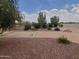 Backyard featuring diverse plantings and gravel beds offering a serene, low-maintenance outdoor space for relaxation or entertaining at 40232 W Marion May Ln, Maricopa, AZ 85138
