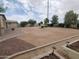 Spacious backyard with lush landscaping, gravel beds, and defined areas, perfect for outdoor activities and relaxation at 40232 W Marion May Ln, Maricopa, AZ 85138