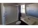 Bathroom with tub/shower combination and modern fixtures at 40232 W Marion May Ln, Maricopa, AZ 85138