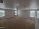 Large bedroom features neutral paint, carpet, and windows offering ample natural light at 40232 W Marion May Ln, Maricopa, AZ 85138