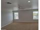Spacious carpeted room with ample natural light at 40232 W Marion May Ln, Maricopa, AZ 85138