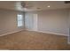 Bedroom featuring carpet, a window, and a ceiling fan at 40232 W Marion May Ln, Maricopa, AZ 85138