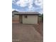 A charming outbuilding is complemented by elegant brick paving and meticulous landscaping, enhancing this home's curb appeal at 40232 W Marion May Ln, Maricopa, AZ 85138