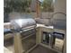 State-of-the-art outdoor kitchen featuring stainless steel appliances and plenty of prep and storage space, perfect for outdoor dining at 40232 W Marion May Ln, Maricopa, AZ 85138