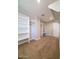 Walk-in closet featuring custom shelving and plenty of space at 40232 W Marion May Ln, Maricopa, AZ 85138