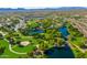 Aerial view of a park including walking paths, lakes, and landscaped green spaces at 41006 N Noble Hawk Way, Anthem, AZ 85086