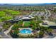 Aerial view of the community clubhouse, pool, and amenities, surrounded by lush landscaping at 41006 N Noble Hawk Way, Anthem, AZ 85086