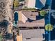 Aerial view of the home, highlighting the backyard pool and desert landscaping at 41006 N Noble Hawk Way, Anthem, AZ 85086