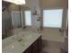 Bathroom featuring a soaking tub, walk-in shower, and dual sink vanity at 4208 E Amarillo Dr, San Tan Valley, AZ 85140