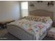 Inviting bedroom featuring a tufted headboard and patterned bedding at 4208 E Amarillo Dr, San Tan Valley, AZ 85140