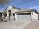 Charming single-story home with a two-car garage, covered entryway, desert landscaping, and a neutral color palette at 4208 E Amarillo Dr, San Tan Valley, AZ 85140