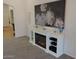 Elegant living room featuring a modern electric fireplace with built-in shelving and stylish decor at 4208 E Amarillo Dr, San Tan Valley, AZ 85140