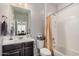 Bathroom with a vanity and a bathtub/shower combination with a curtain at 4281 E Mesquite St, Gilbert, AZ 85296