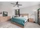 Bedroom featuring a ceiling fan, natural light, and a minimalist design at 4281 E Mesquite St, Gilbert, AZ 85296