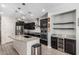 Modern kitchen with stainless steel appliances, granite countertops, large island, and dark cabinetry at 4281 E Mesquite St, Gilbert, AZ 85296