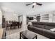 Open concept living room and dining area featuring modern furniture and wood look tile flooring at 4281 E Mesquite St, Gilbert, AZ 85296