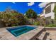 Luxurious backyard spa featuring stone accents and a relaxing water feature with elegant tile design at 4281 E Mesquite St, Gilbert, AZ 85296