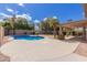 Backyard with pool, patio, and desert landscaping, offering a relaxing outdoor living space at 4643 E Villa Maria Dr, Phoenix, AZ 85032