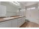 Well-lit bathroom featuring dual sinks, tile floors, and shower over tub at 4643 E Villa Maria Dr, Phoenix, AZ 85032