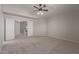 Bright bedroom with neutral carpet and ceiling fan, offering a peaceful retreat at 4643 E Villa Maria Dr, Phoenix, AZ 85032