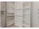 Walk-in closet with custom shelving, perfect for organization at 4643 E Villa Maria Dr, Phoenix, AZ 85032