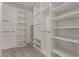 Walk-in closet with custom shelving, perfect for organization at 4643 E Villa Maria Dr, Phoenix, AZ 85032