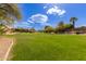 Community green space with mature landscaping and walking paths, offering a serene outdoor environment at 4643 E Villa Maria Dr, Phoenix, AZ 85032