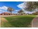 Scenic neighborhood view with well-maintained lawns, mature trees, and charming single-story homes under a bright blue sky at 4643 E Villa Maria Dr, Phoenix, AZ 85032