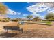 Community playground featuring swings, climbing structures, and a bench for relaxation at 4643 E Villa Maria Dr, Phoenix, AZ 85032