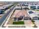 Stunning aerial view of a single-Gathering home with a well-manicured lawn and a paver driveway at 4834 S Meteor --, Mesa, AZ 85212