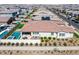 A bird's eye view of a home with a patio, lush yard, and desert landscaping in a planned community at 4834 S Meteor --, Mesa, AZ 85212