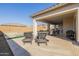 Covered patio with dining and lounge area, overlooks a pool, and provides the perfect outdoor retreat at 4834 S Meteor --, Mesa, AZ 85212