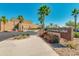 Visitor and Community Center entrance with desert landscaping, mature palm trees, and clear blue sky at 4834 S Meteor --, Mesa, AZ 85212