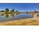 Scenic view of community lake reflecting the sky and surrounding landscape, enhancing the neighborhood's appeal at 4834 S Meteor --, Mesa, AZ 85212