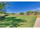 Picturesque community park with green spaces, walking paths, and manicured landscaping at 4834 S Meteor --, Mesa, AZ 85212