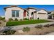 Beautiful home featuring a well-maintained lawn and attractive desert landscaping at 4834 S Meteor --, Mesa, AZ 85212